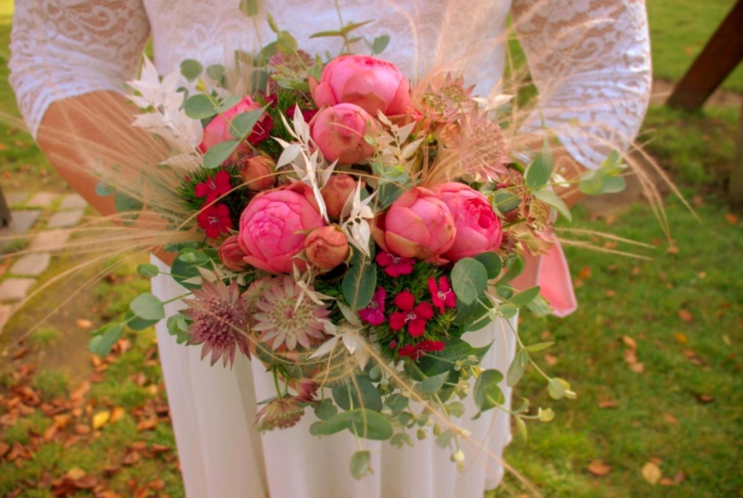 Completed floral arrangements from student sessions — varied styles and colour palettes